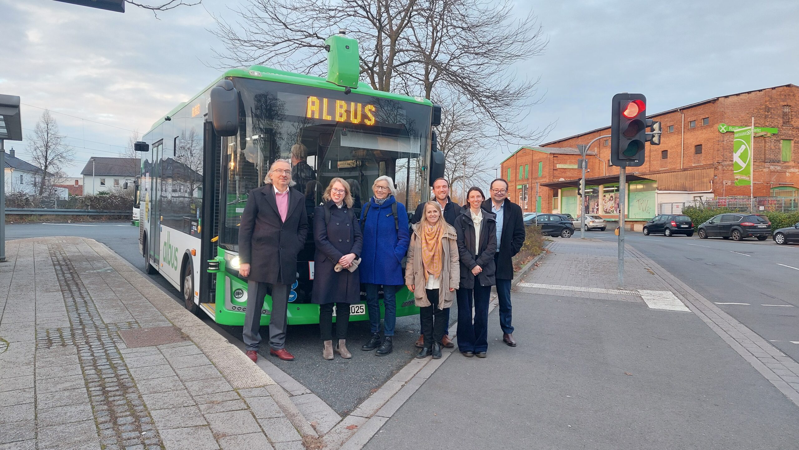 MIMS team stood in front of Albus bus