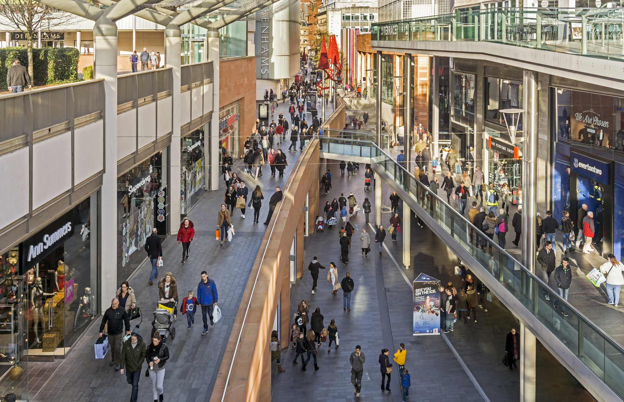 Photo of shopping mall full of people